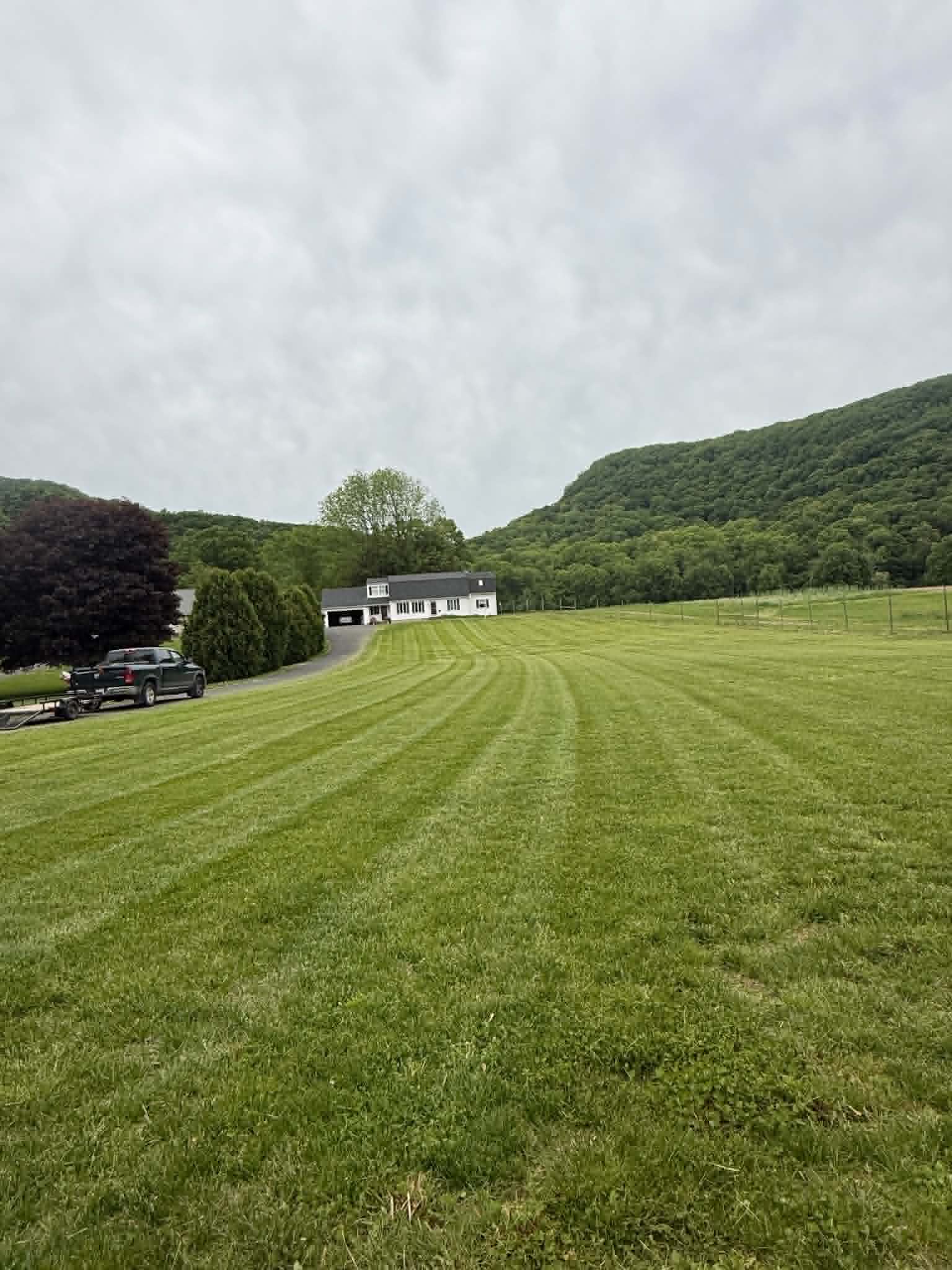 Large hillside property lawn with fresh mowing lines